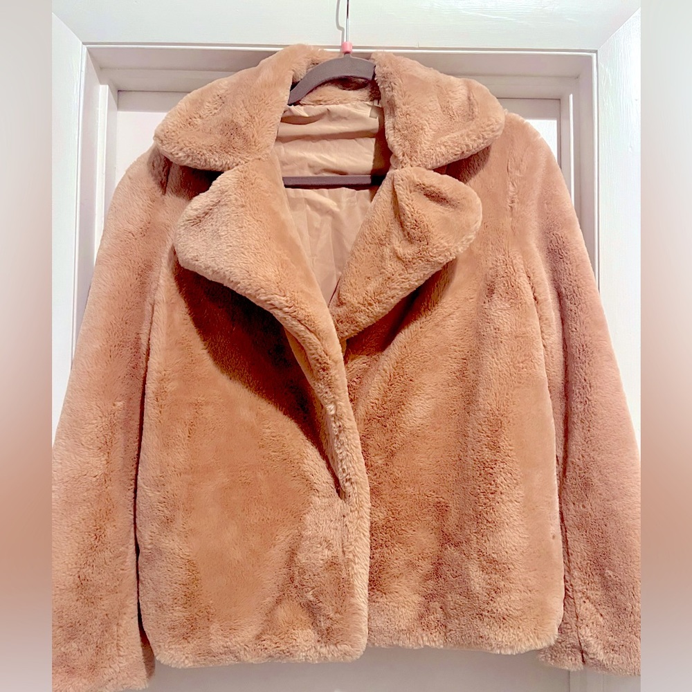 Blush colored faux fur jacket.